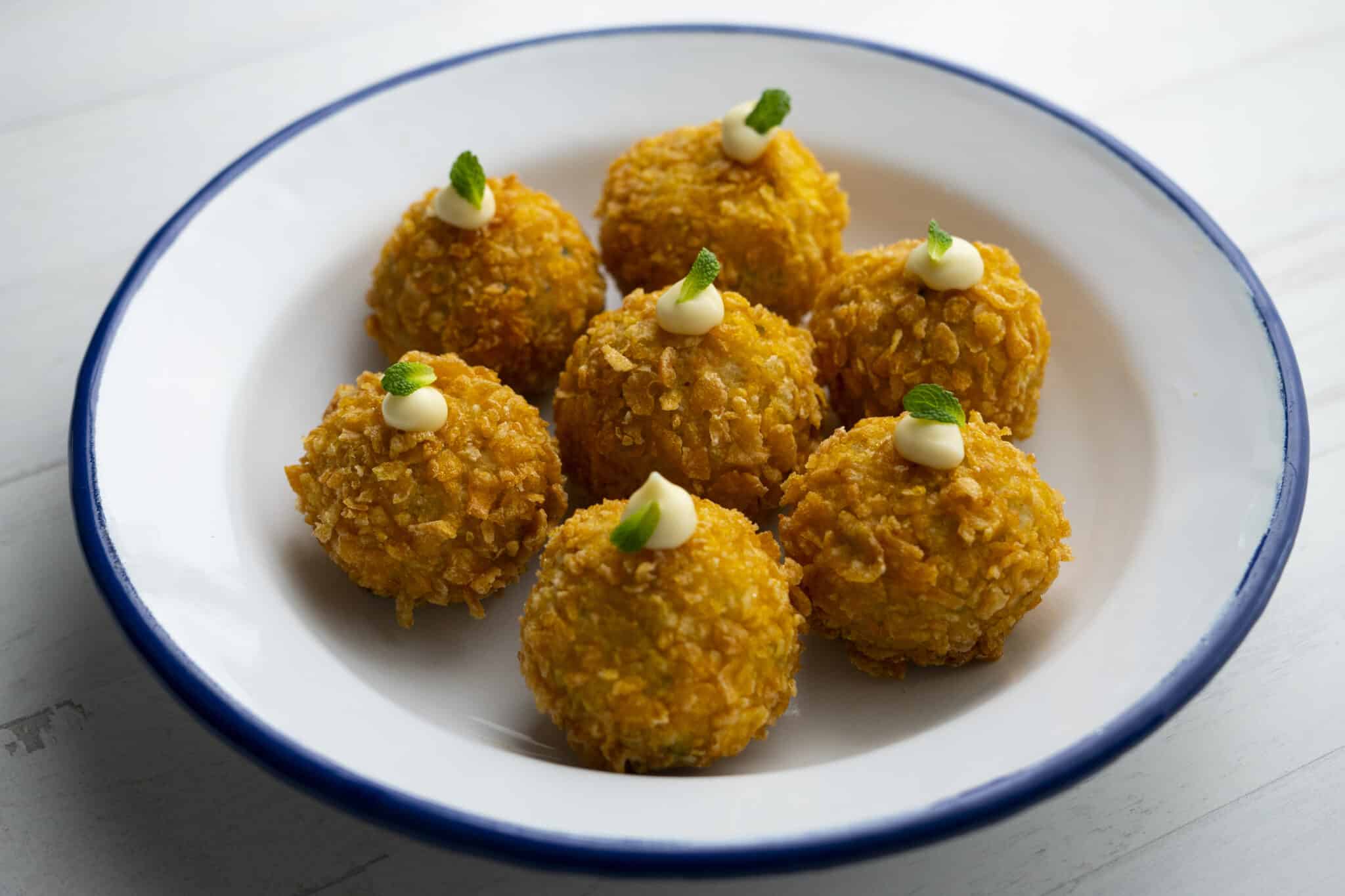 Traditional Spanish croquettes tapa with a little mayonnaise on top.